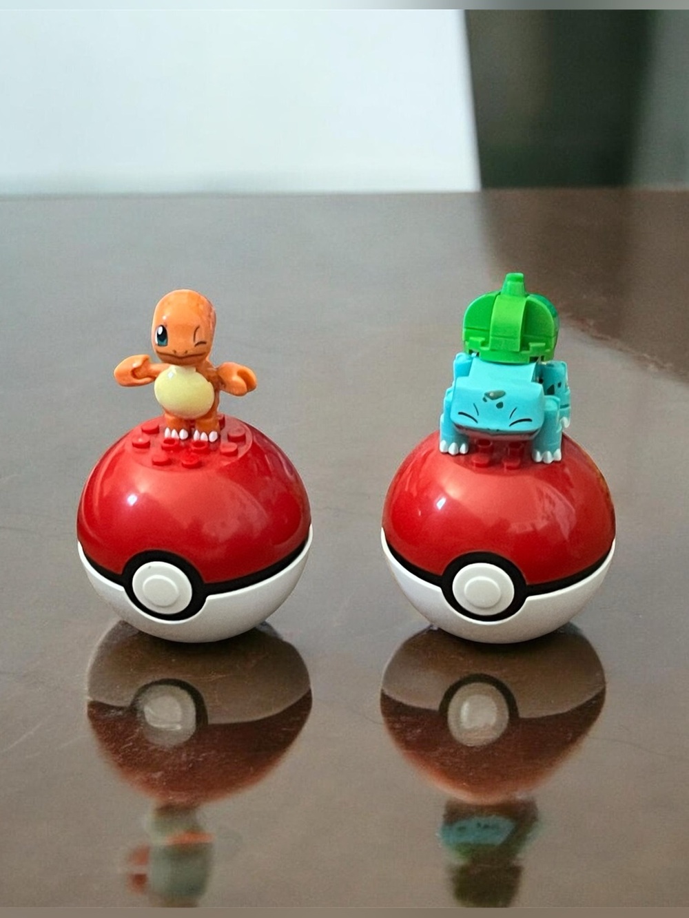 Mini Figure Playset with Orange and Blue-Green Creature Figures on Red Bases